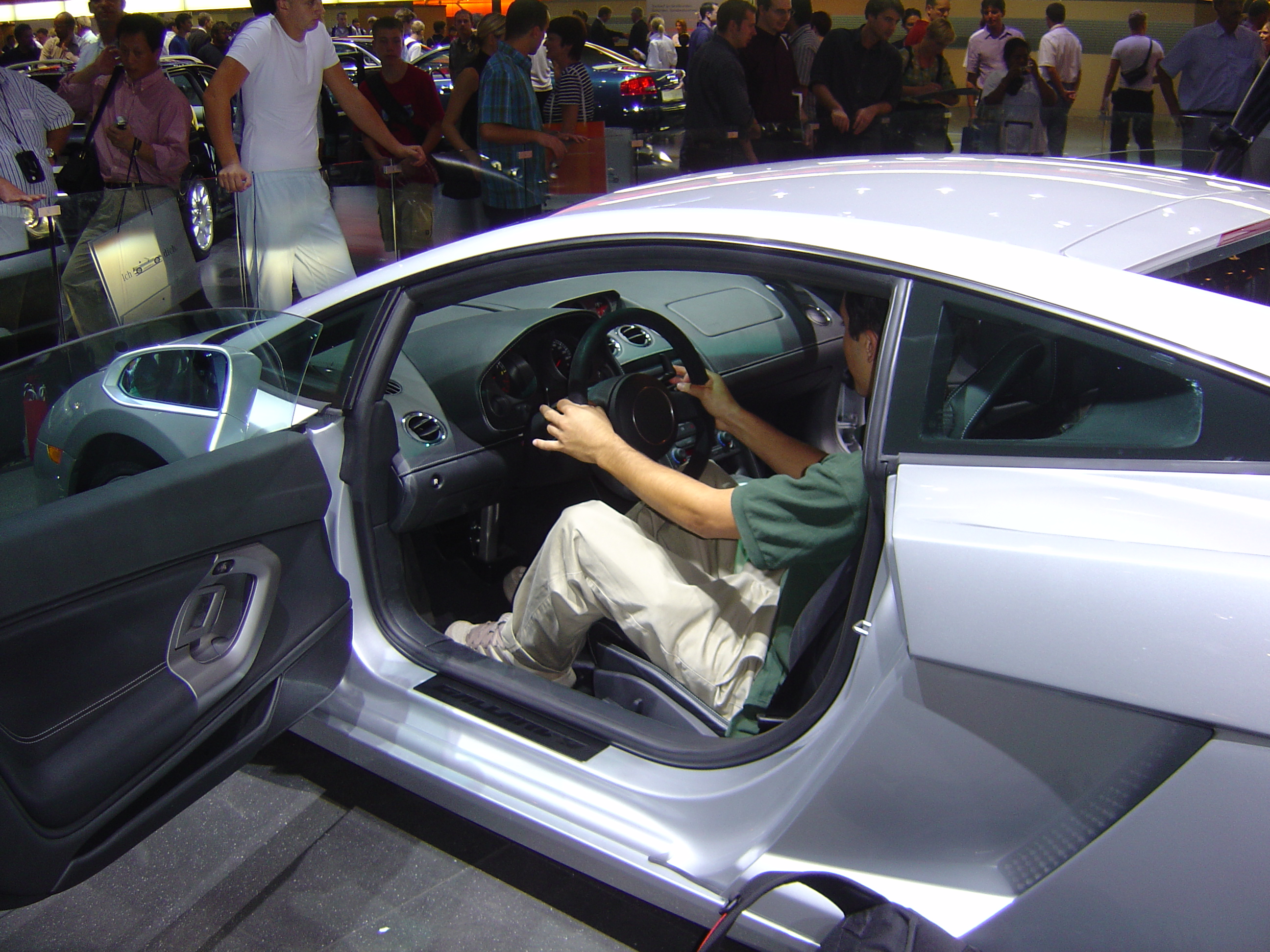 Young Nicolás inside a supercar cabin